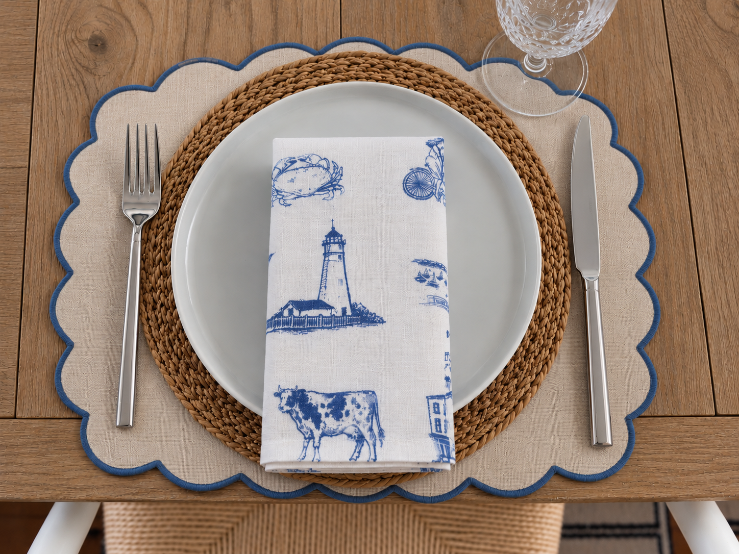 Folded Northport linen napkin featuring Eaton’s Neck Lighthouse and coastal Long Island motifs