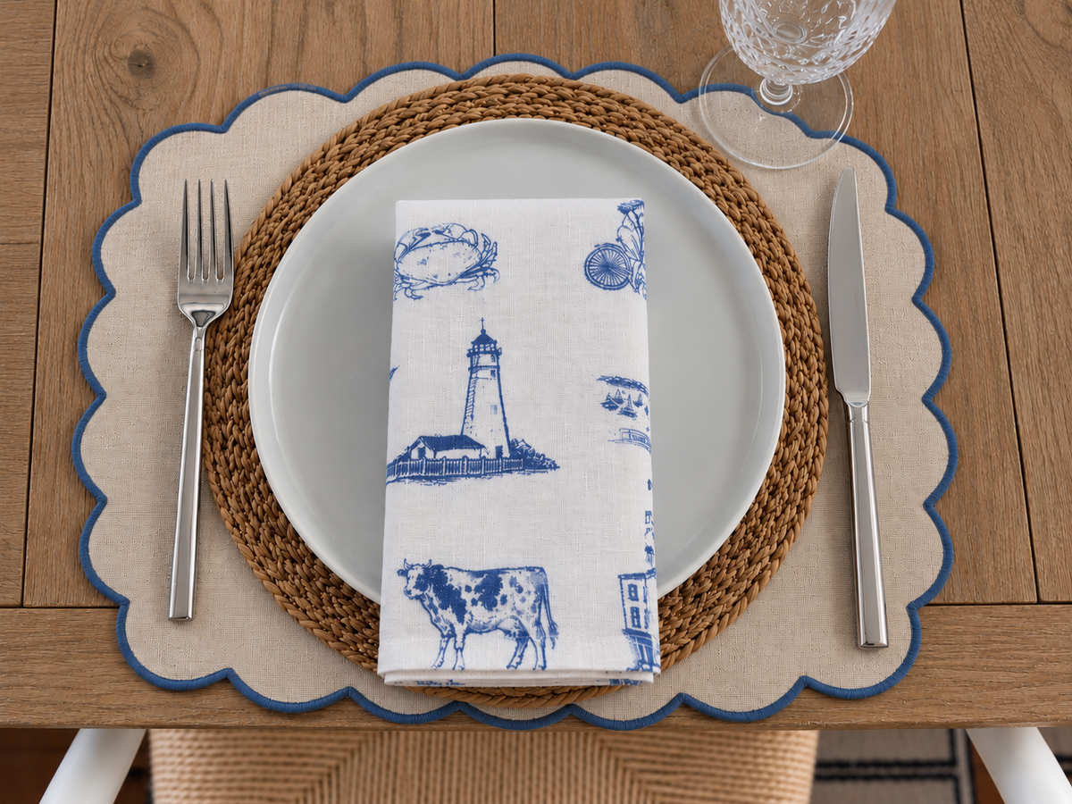 Folded Northport linen napkin featuring Eaton’s Neck Lighthouse and coastal Long Island motifs