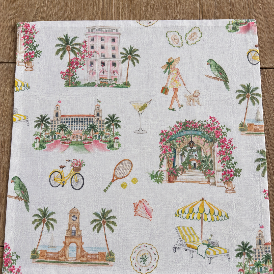 Oyster and Arrow Palm Beach linen napkin with colorful hand-illustrated Worth Avenue Clock Tower, The Breakers, Colony Hotel and Via Parigi motifs
