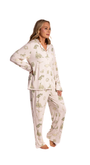 Woman wearing a white floral toile pajama set on a white background from oyster and arrow