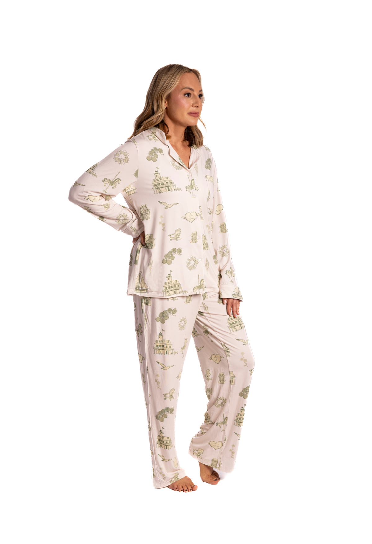 Woman wearing a white floral toile pajama set on a white background from oyster and arrow