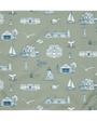 Fabric with blue coastal-themed pattern on a green background