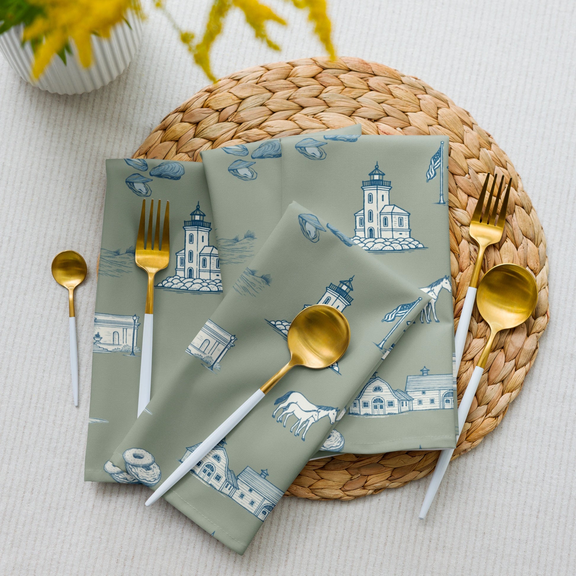 Napkins with lighthouse design on a woven placemat with cutlery